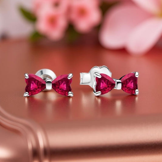 Tachuelas con lazo rojo