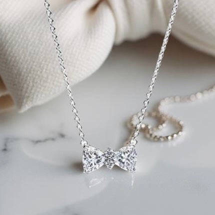 SILVER BOW NECKLACE