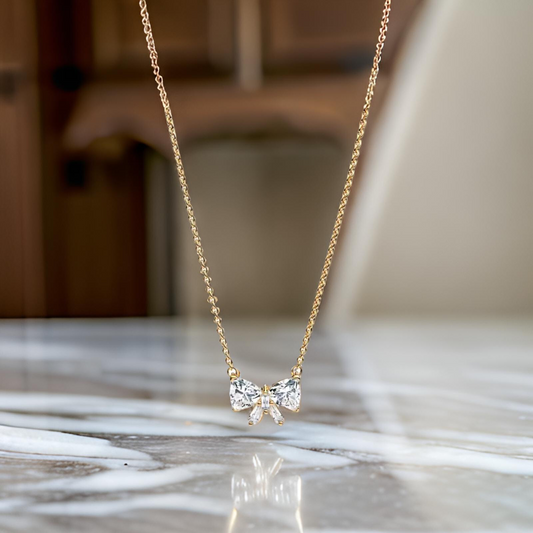 COLLAR CON LAZO DORADO